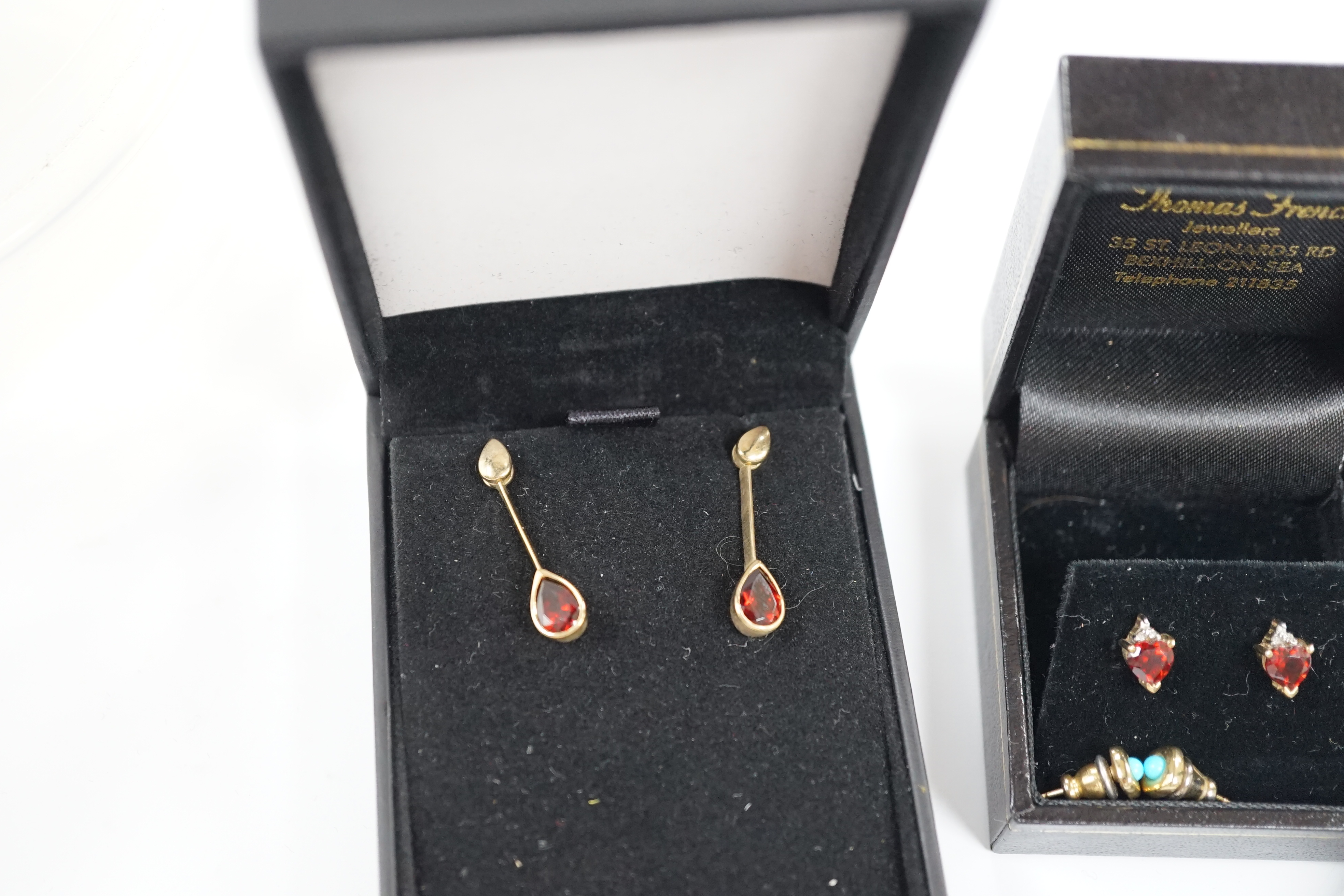 Four assorted pairs of gem set ear studs including 9ct gold and white opal and 9ct gold and garnet.